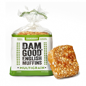 Packaged multigrain Dam Good English Muffins with a single muffin on a white background