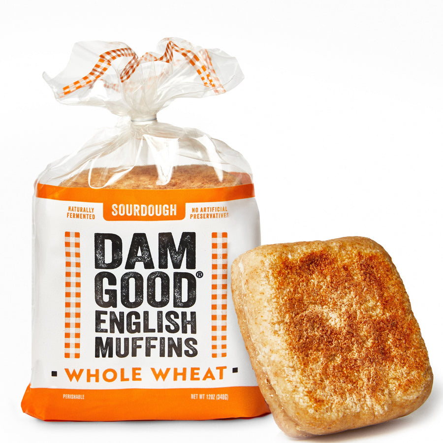 Bag of Dam Good English Muffins Whole Wheat with a single muffin on a white background