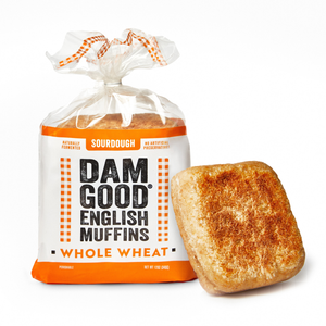 Bag of Dam Good English Muffins Whole Wheat with a single muffin on a white background